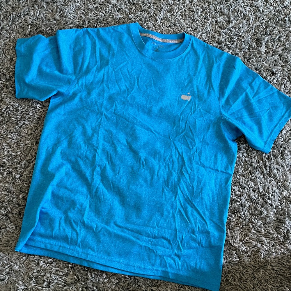 The Masters Golf Tee Shirt authentic size Medium Blue. Bought at Augusta NEW